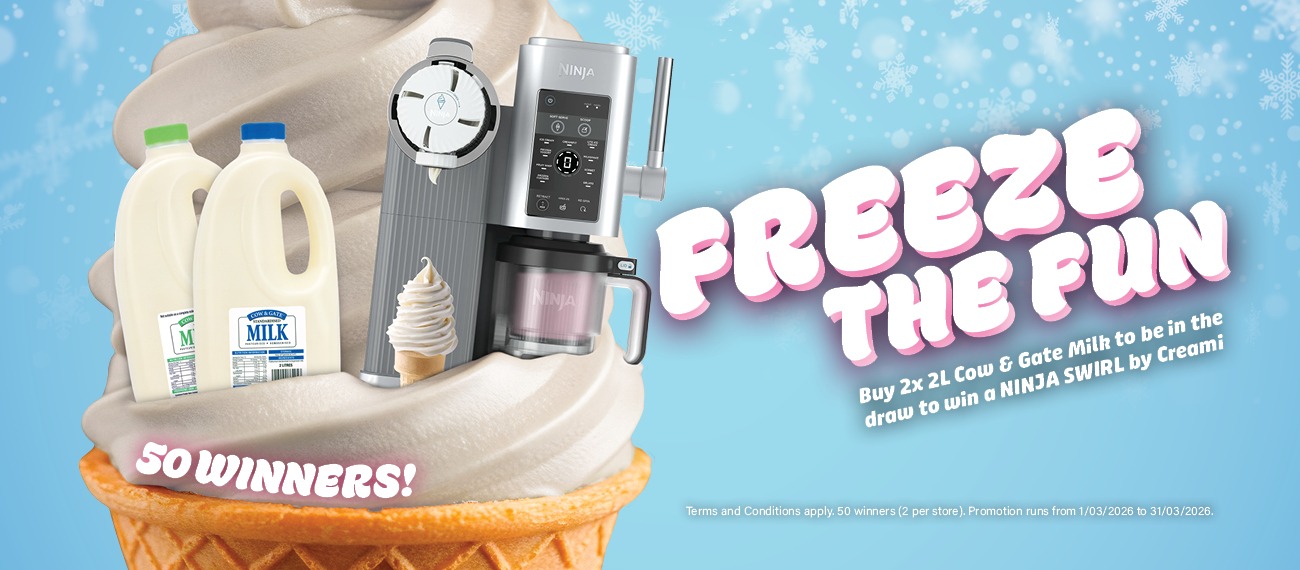 Soft serve ice cream cone with two bottles of milk nested in the ice cream, alongside a Ninja Swirl by Creami machine. 